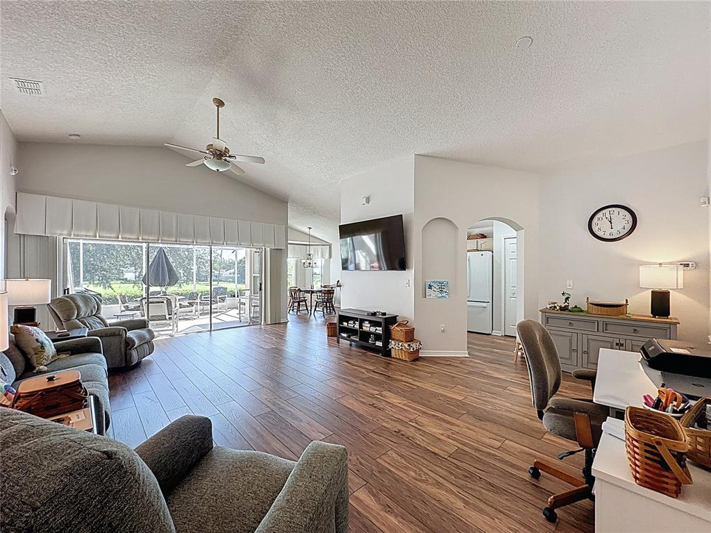 2292 Edmonton Court Clermont, FL 34711 - Photo 13 of 76 a living room with furniture and a large window