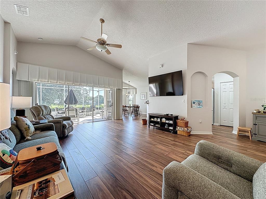 2292 Edmonton Court Clermont, FL 34711 - Photo 14 of 76 a living room with furniture and a large window