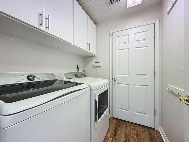 a open kitchen with stainless steel appliances granite countertop a stove and cabinets