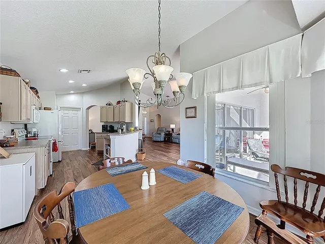 a spacious bedroom with a bed and a couch