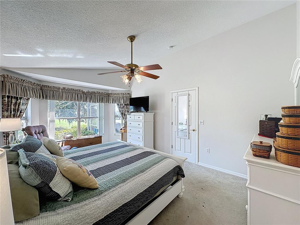 2292 Edmonton Court Clermont, FL 34711 - Photo 27 of 76 a bedroom with a bed and window