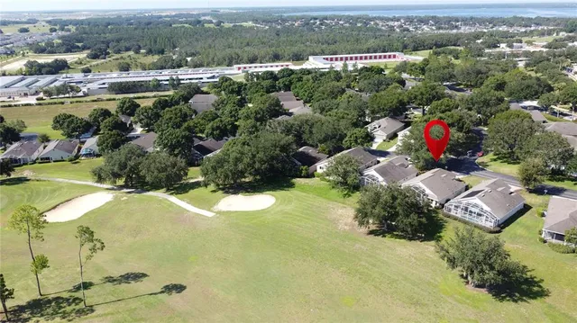 a view of livingroom with hardwood floor and a hallway