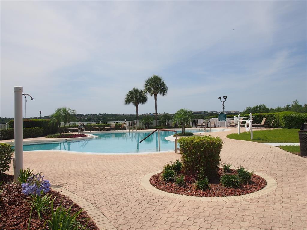 2292 Edmonton Court Clermont, FL 34711 - Photo 72 of 76 a view of a swimming pool with a lake