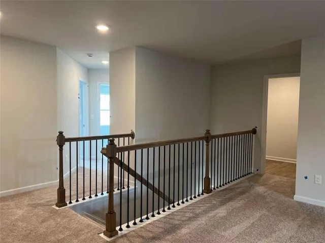 a view of a hallway with a window