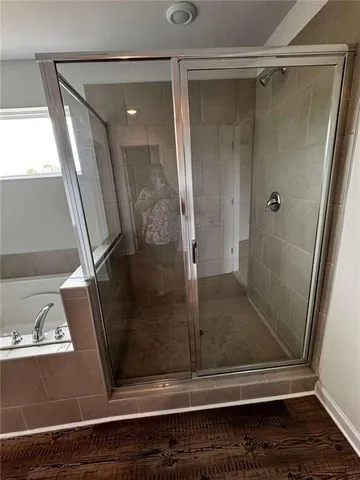 a bath tub sitting next to a window
