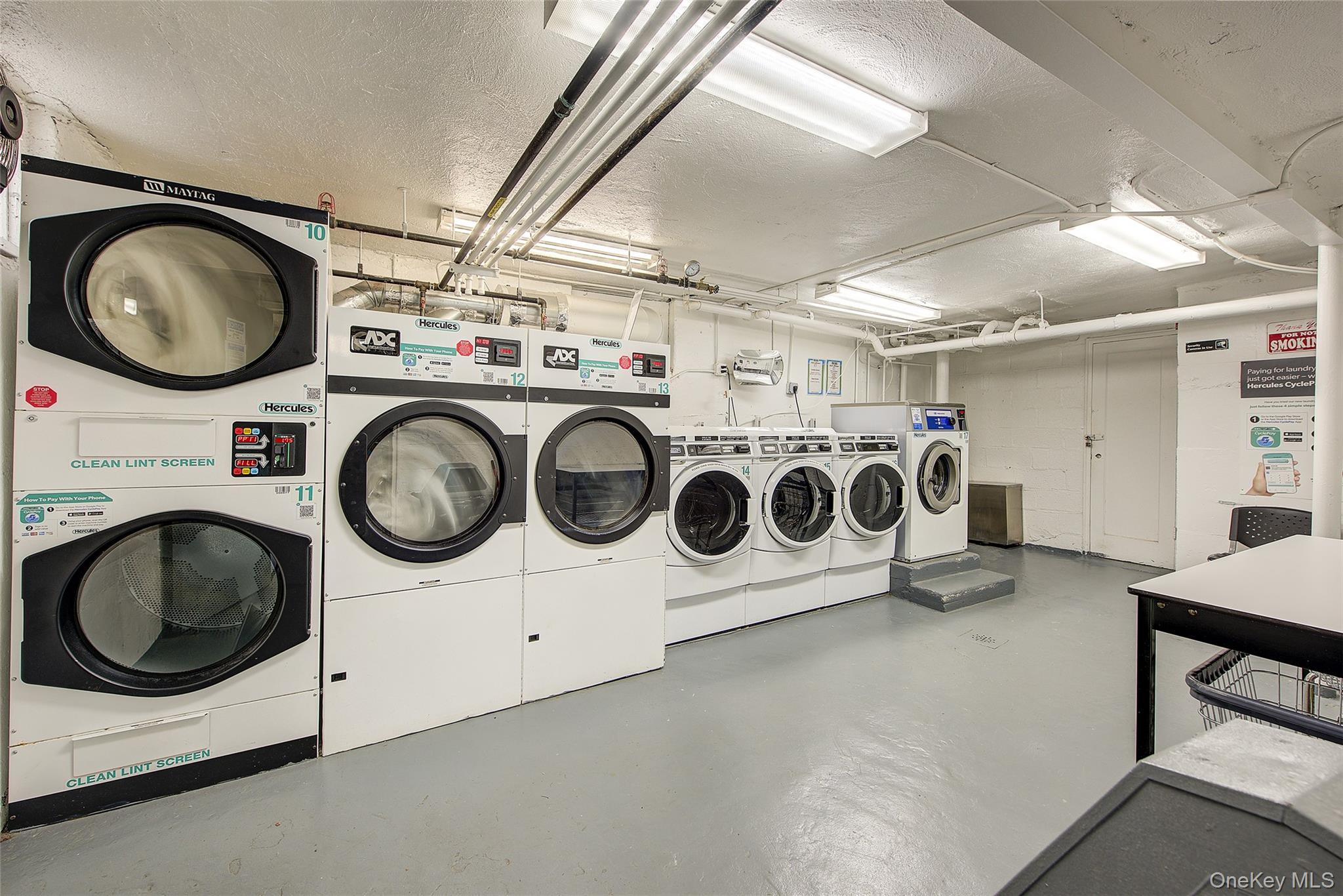 46-42 215th Place, Unit 1C Queens, NY 11361 - Photo 22 of 28 a utility room with dryer and washer