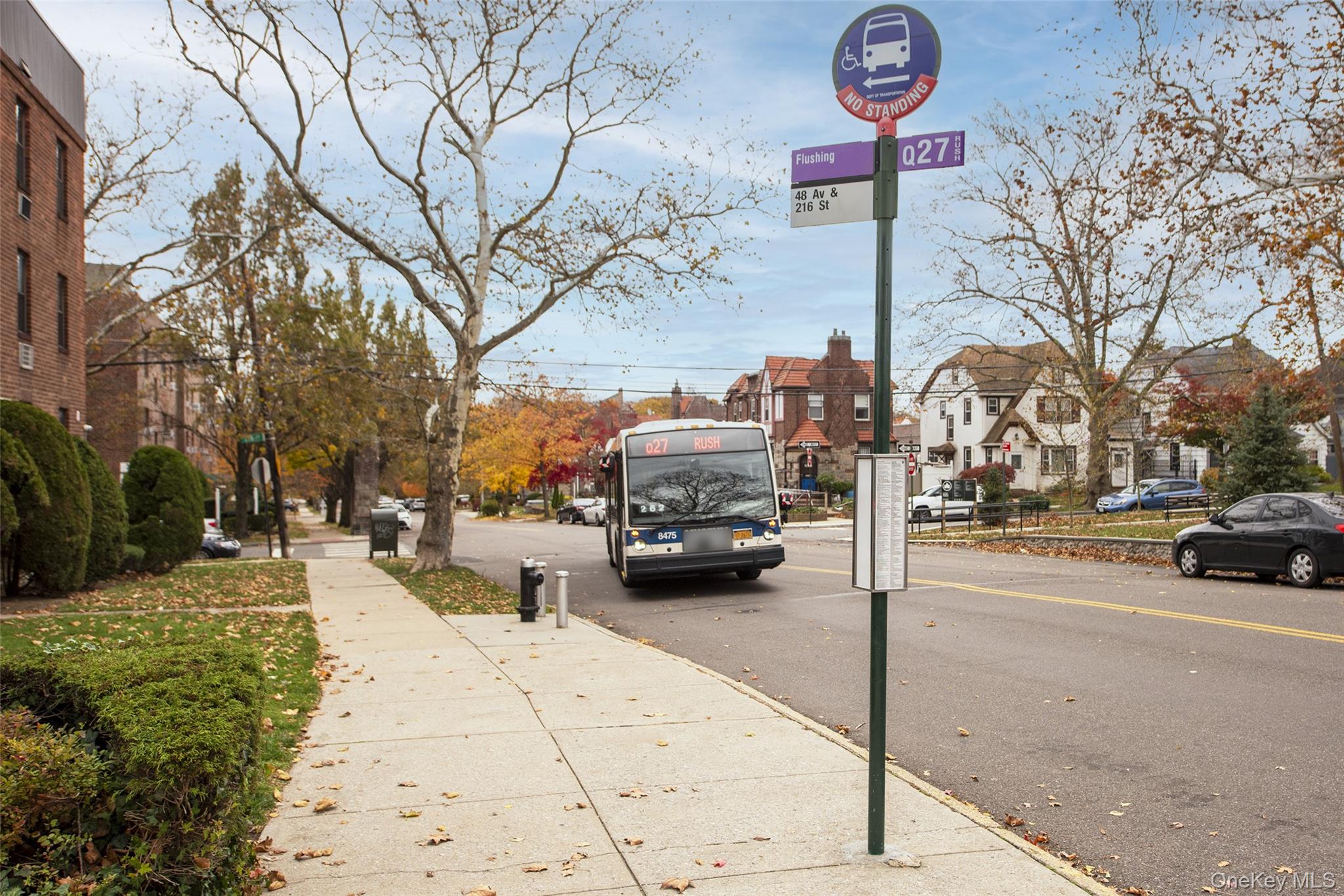 46-42 215th Place, Unit 1C Queens, NY 11361 - Photo 24 of 28 a view of a street with cars