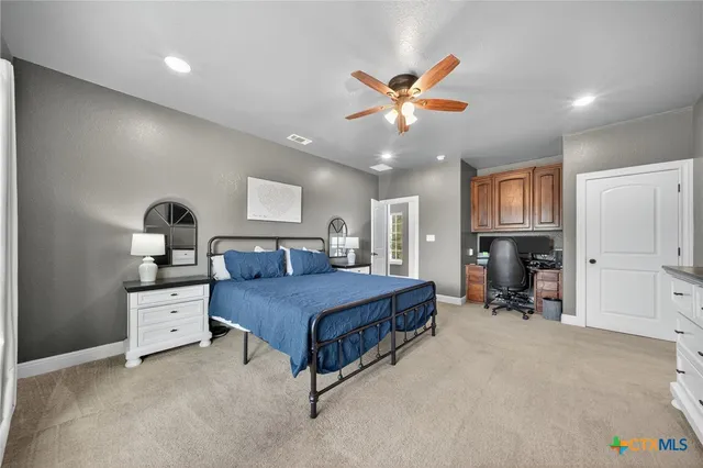 a bathroom with a granite countertop sink mirror and