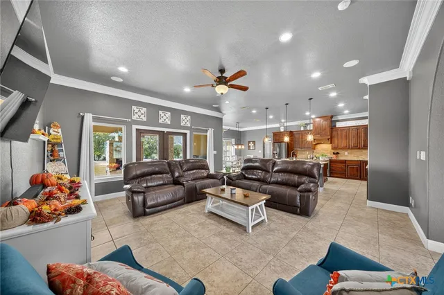 a large kitchen with granite countertop lots of counter top and sink
