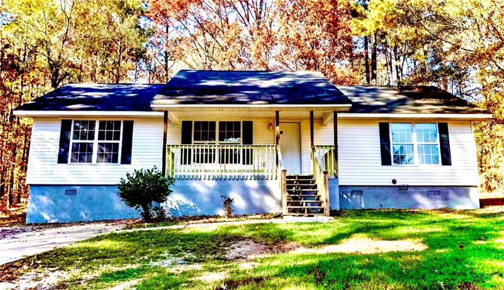 368 Rocky Point Road Covington, GA 30014 - Photo 1 of 1 a view of house with a yard