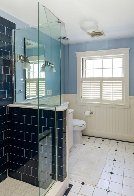 27 Metacomet Road Newton, MA 02468 - Photo 15 of 22 a bathroom with a granite countertop sink a toilet and shower