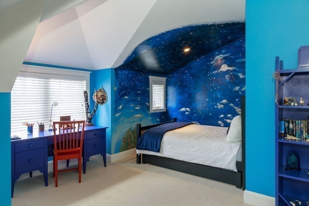 27 Metacomet Road Newton, MA 02468 - Photo 17 of 22 a bedroom with a bed and a bookshelf with a bookshelf