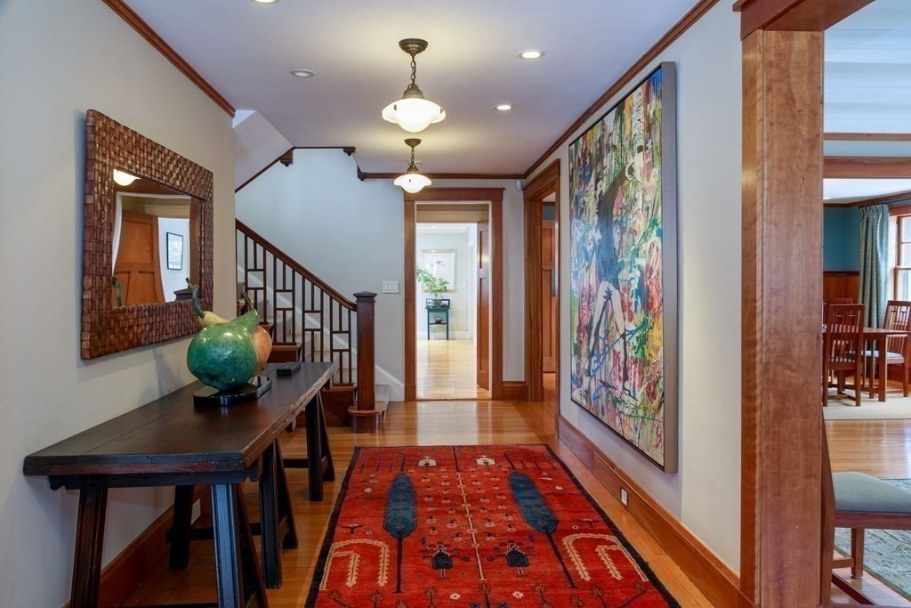 27 Metacomet Road Newton, MA 02468 - Photo 3 of 22 a view of a hallway with wooden floor and furniture
