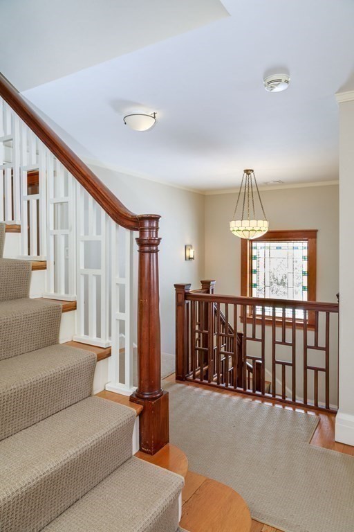 27 Metacomet Road Newton, MA 02468 - Photo 9 of 22 a living room with fireplace furniture and a ceiling fan