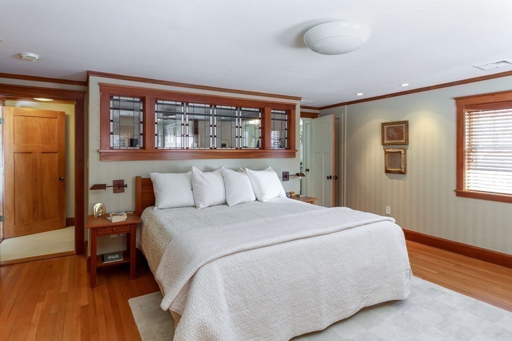 27 Metacomet Road Newton, MA 02468 - Photo 10 of 22 a bedroom with a bed and wooden floor