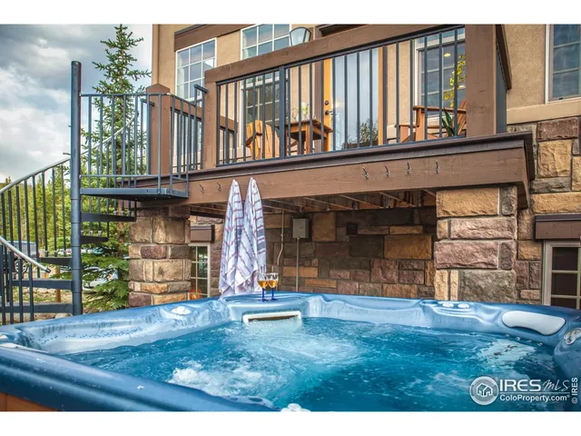 a view of a porch with a wooden fence