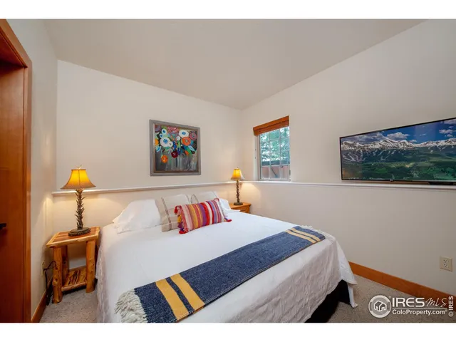 a bedroom with a bed and a table in it