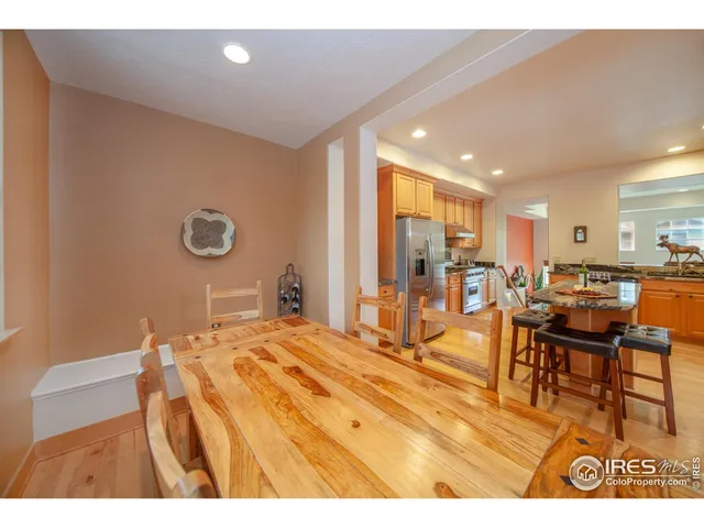 a bedroom with a bed a table and chairs