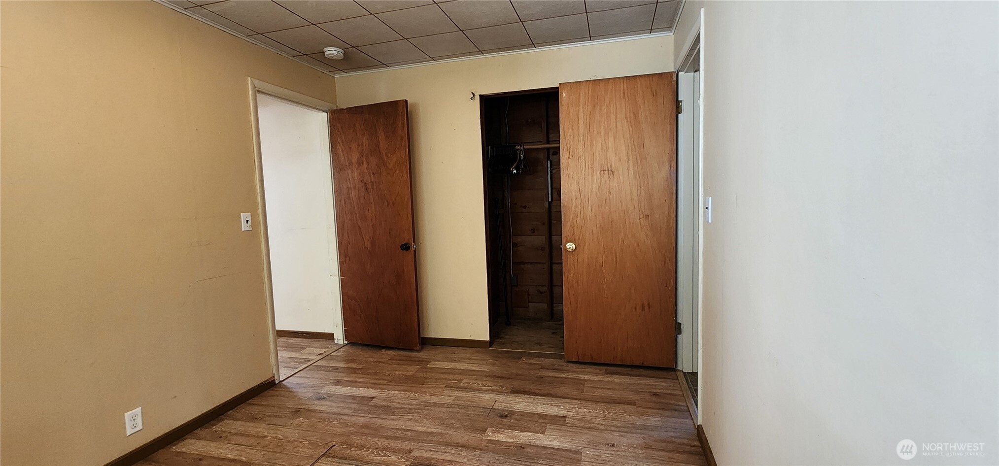 1216 Kaiser Road Southwest Olympia, WA 98512 - Photo 12 of 31 a view of an empty room with wooden floor