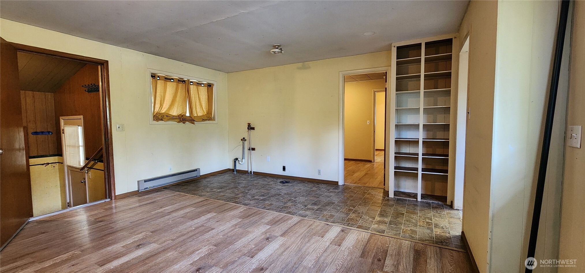 1216 Kaiser Road Southwest Olympia, WA 98512 - Photo 14 of 31 a view of empty room with wooden floor and windows