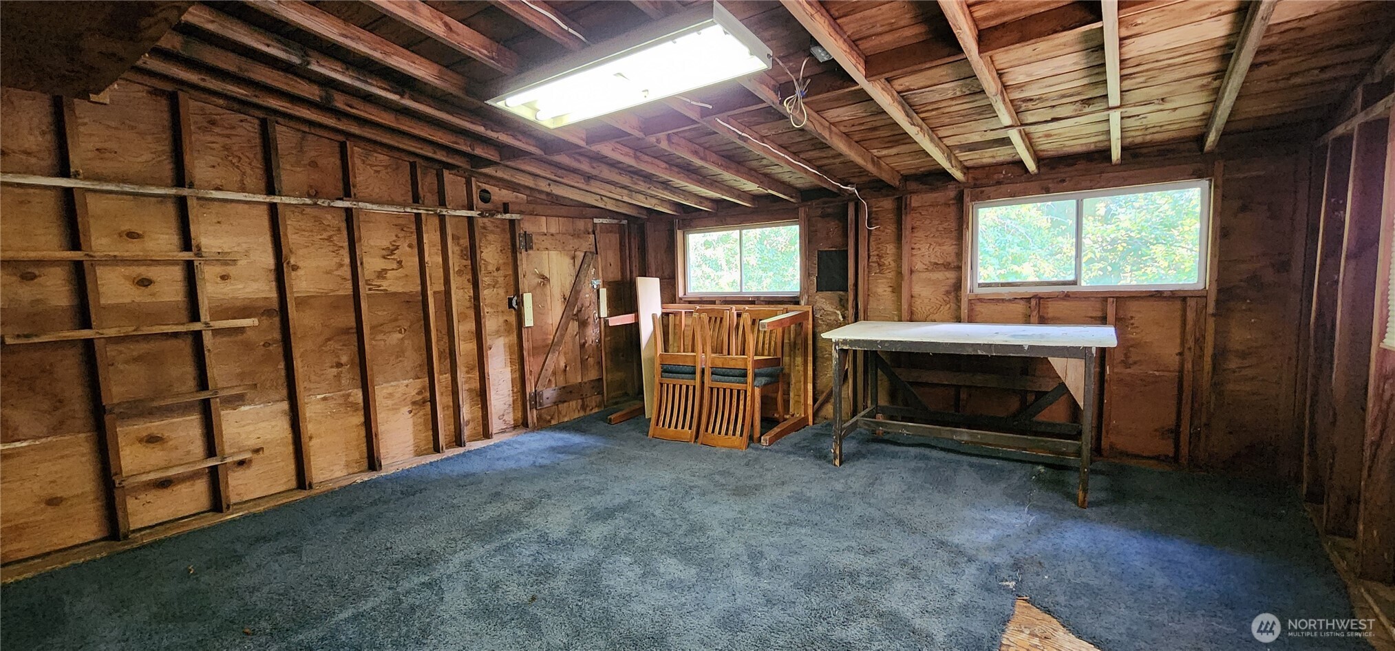 1216 Kaiser Road Southwest Olympia, WA 98512 - Photo 17 of 31 a view of an empty room with furniture and windows