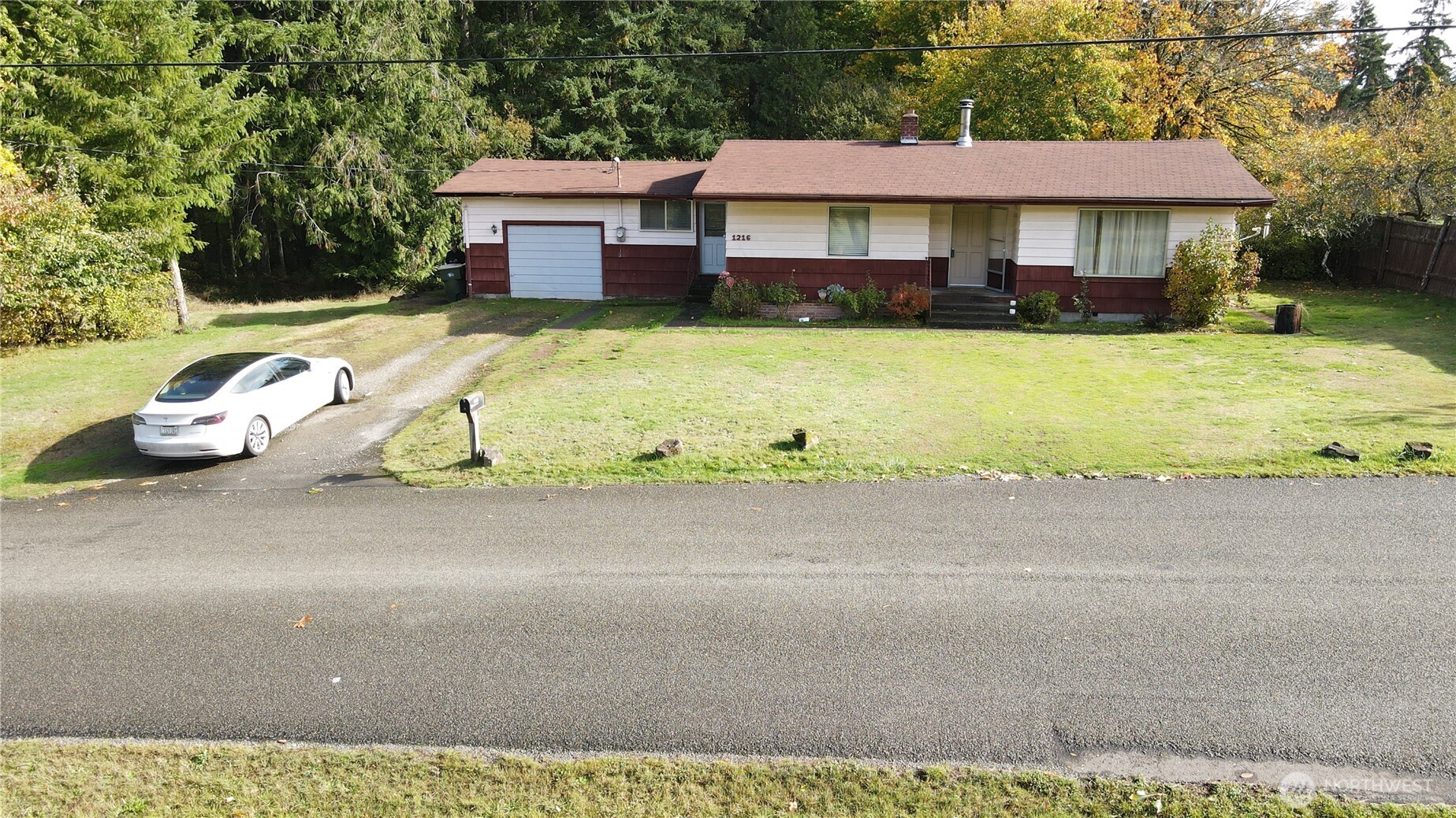 1216 Kaiser Road Southwest Olympia, WA 98512 - Photo 31 of 31 a view of a house with swimming pool and sitting area