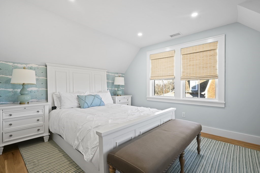 9 Tuckernuck Avenue Oak Bluffs, MA 02557 - Photo 11 of 30 a bedroom with a bed and a dresser