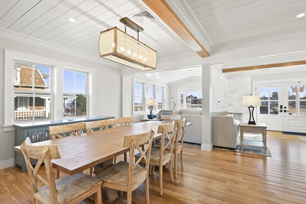 9 Tuckernuck Avenue Oak Bluffs, MA 02557 - Photo 15 of 30 a view of a dining room with furniture wooden floor and chandelier