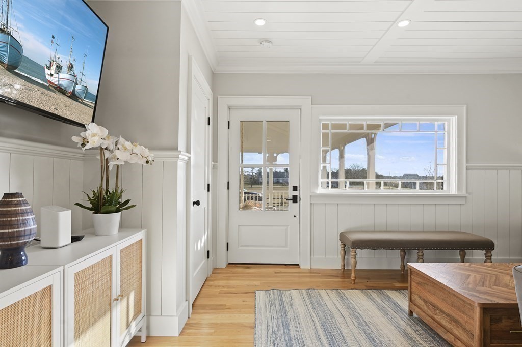 9 Tuckernuck Avenue Oak Bluffs, MA 02557 - Photo 19 of 30 a living room with furniture and wooden floor