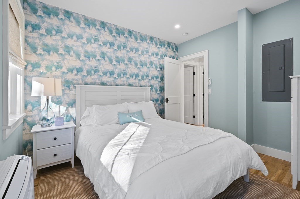 9 Tuckernuck Avenue Oak Bluffs, MA 02557 - Photo 21 of 30 a bedroom with a bed and a window