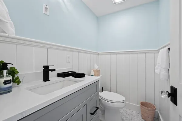 a view of washer and dryer with kitchen in the background