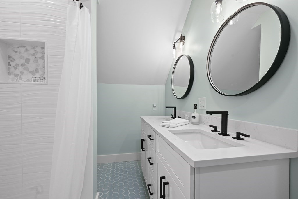 9 Tuckernuck Avenue Oak Bluffs, MA 02557 - Photo 29 of 30 a bathroom with a sink and a mirror