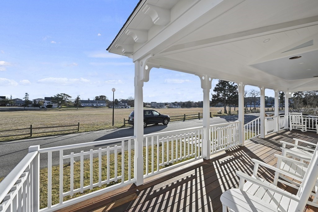 9 Tuckernuck Avenue Oak Bluffs, MA 02557 - Photo 30 of 30 a view of a balcony with wooden floor