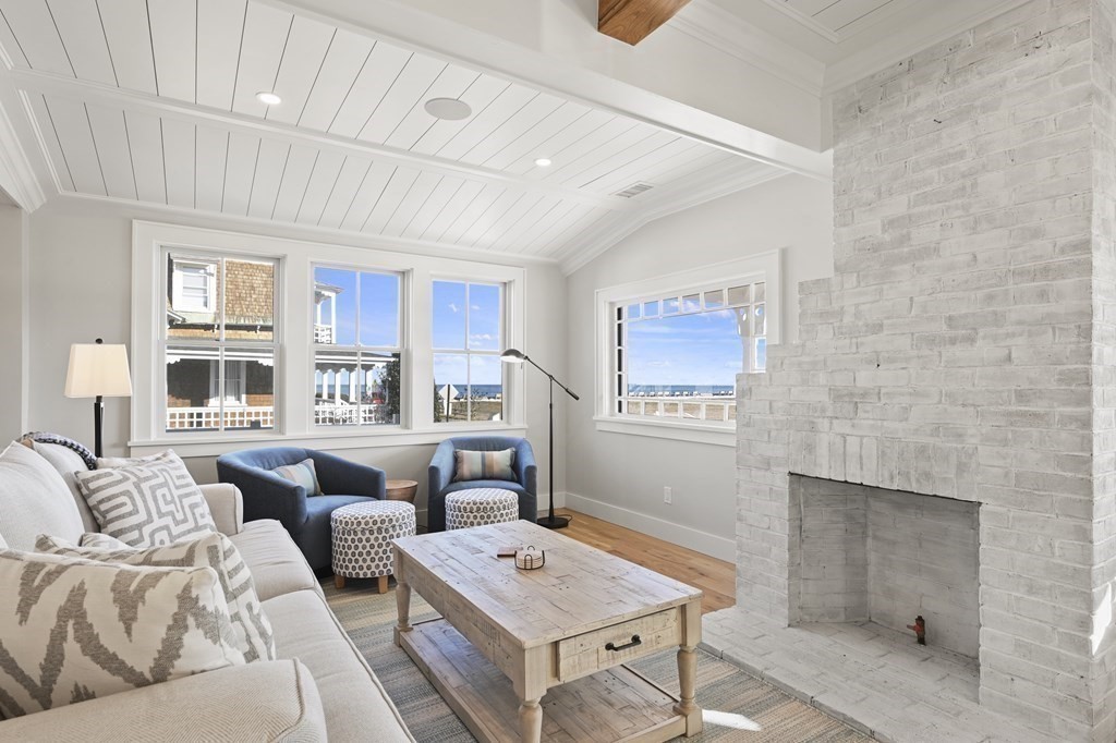 9 Tuckernuck Avenue Oak Bluffs, MA 02557 - Photo 4 of 30 a living room with furniture and a table