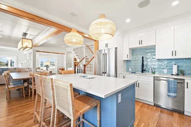 a kitchen with a table and chairs in it