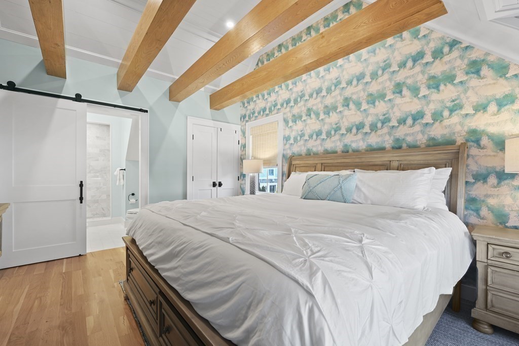 9 Tuckernuck Avenue Oak Bluffs, MA 02557 - Photo 9 of 30 a bedroom with a bed and wooden floor