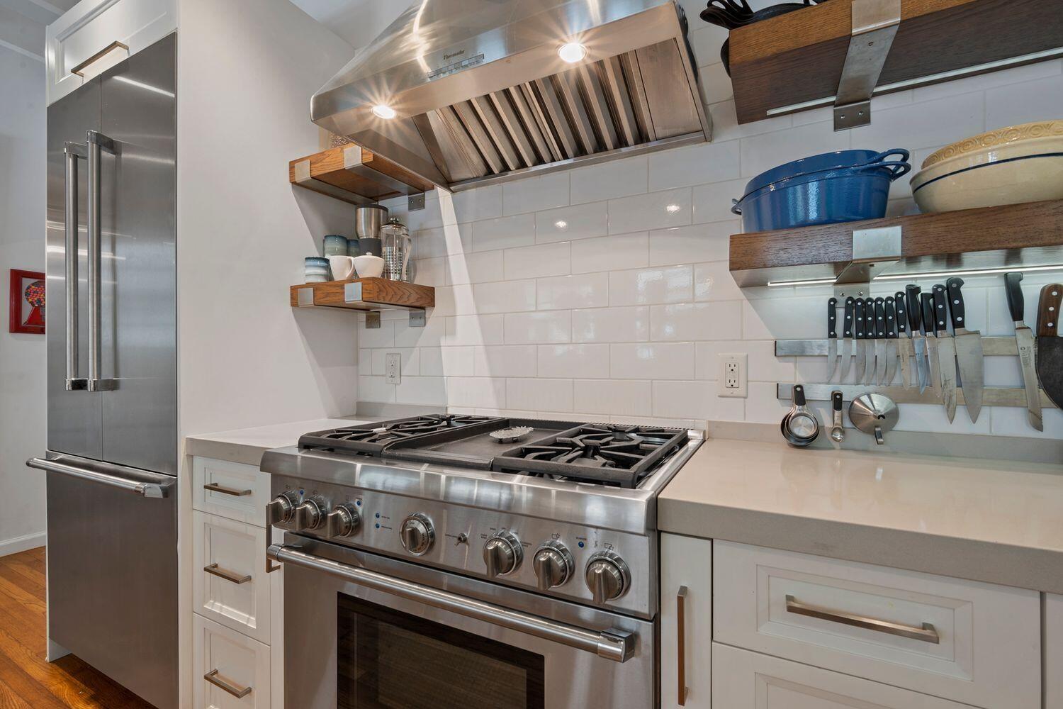302 Northwest 16th Street Delray Beach, FL 33444 - Photo 16 of 46 a kitchen with a stove and a refrigerator