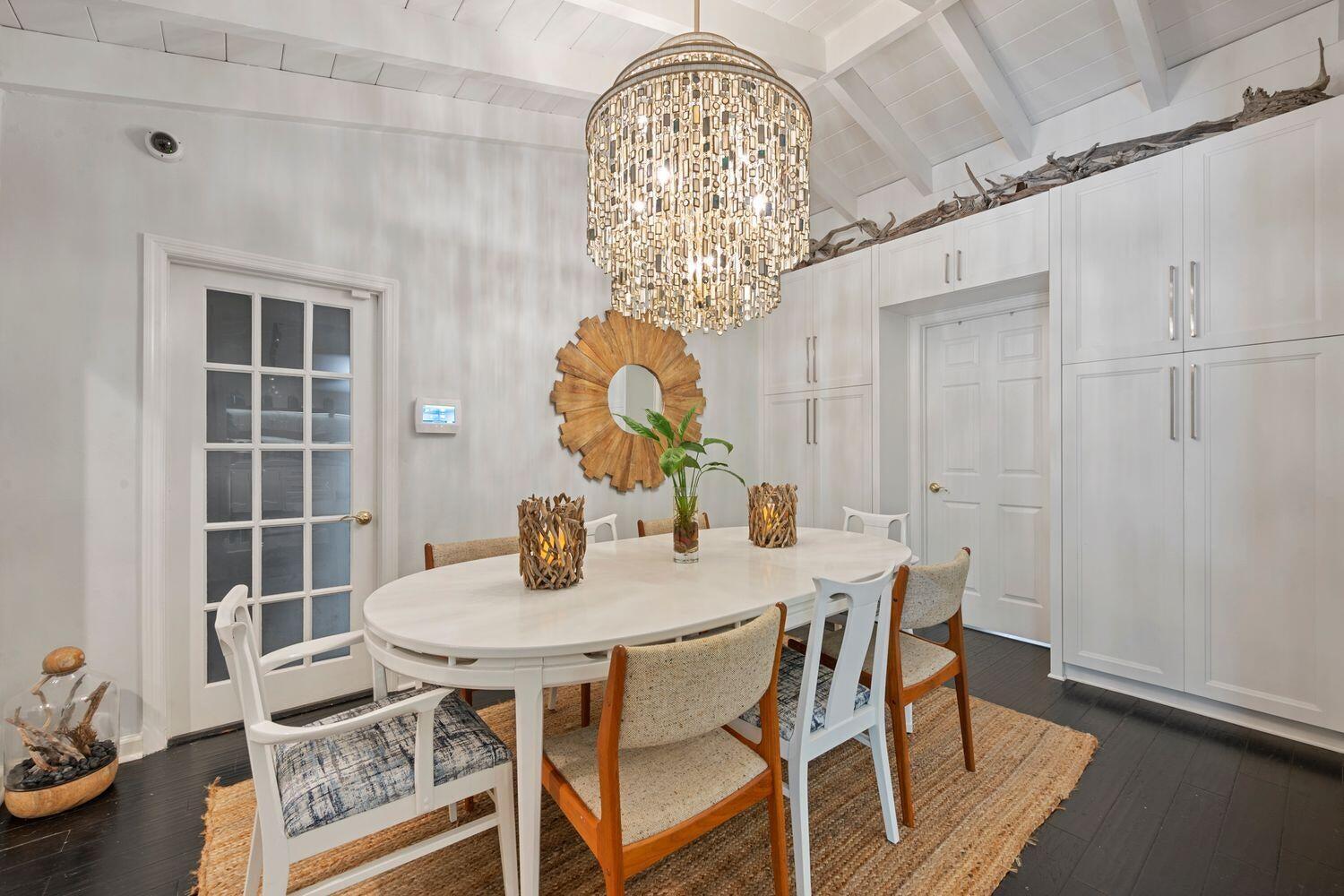 302 Northwest 16th Street Delray Beach, FL 33444 - Photo 18 of 46 a view of a dining room with furniture and chandelier