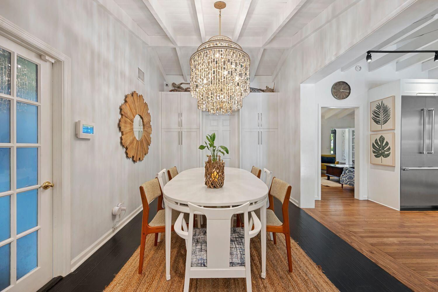 302 Northwest 16th Street Delray Beach, FL 33444 - Photo 19 of 46 a view of a dining room with furniture and chandelier