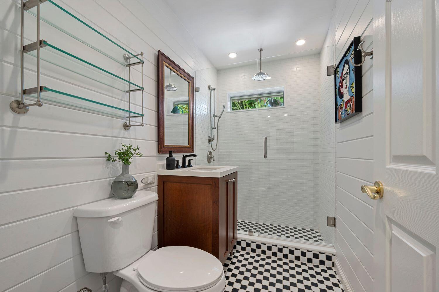 302 Northwest 16th Street Delray Beach, FL 33444 - Photo 31 of 46 a bathroom with a toilet sink and shower