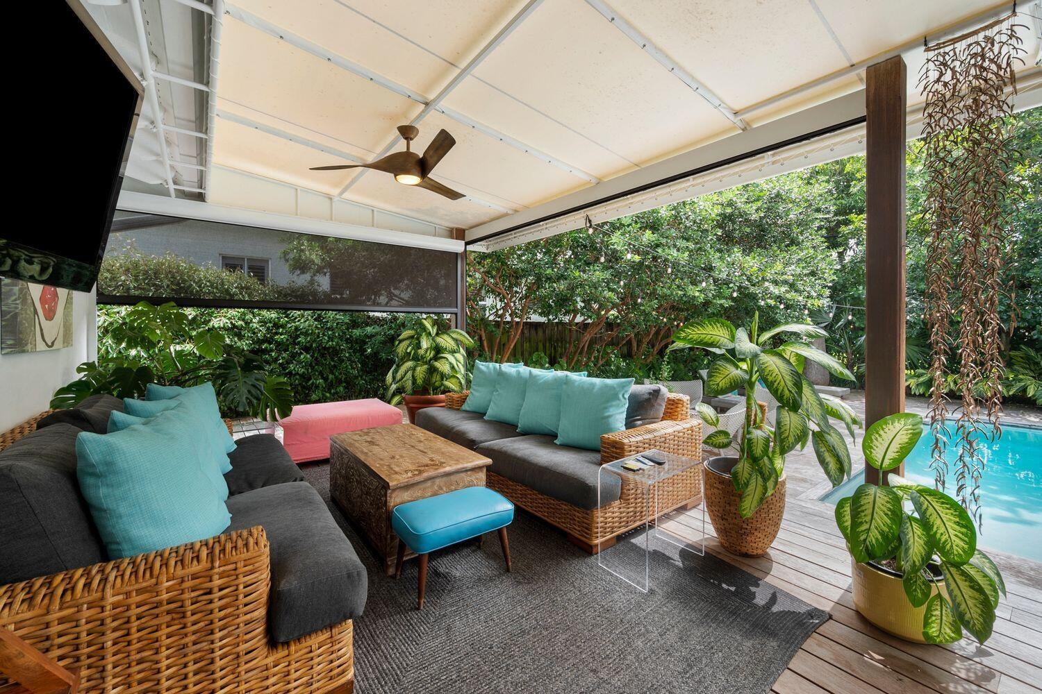 302 Northwest 16th Street Delray Beach, FL 33444 - Photo 40 of 46 a outdoor living space with furniture and garden view