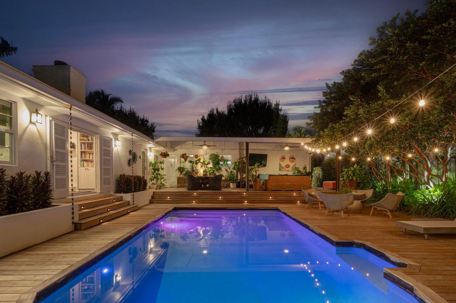 302 Northwest 16th Street Delray Beach, FL 33444 - Photo 5 of 46 a view of a swimming pool with an outdoor seating