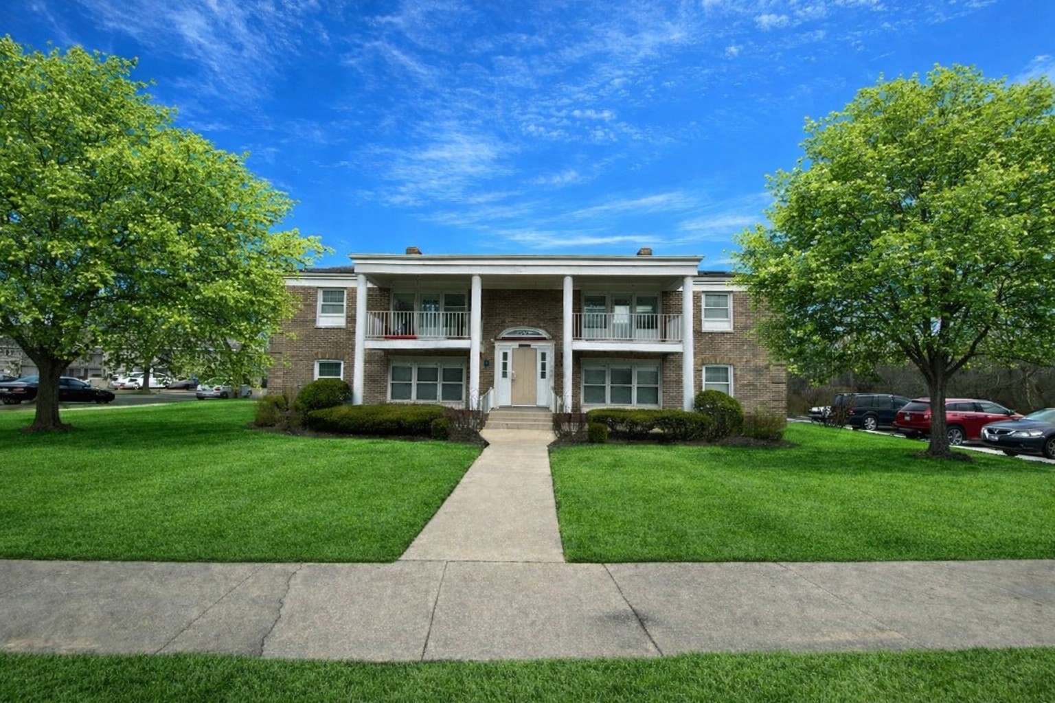 a view of an house with backyard space and garden