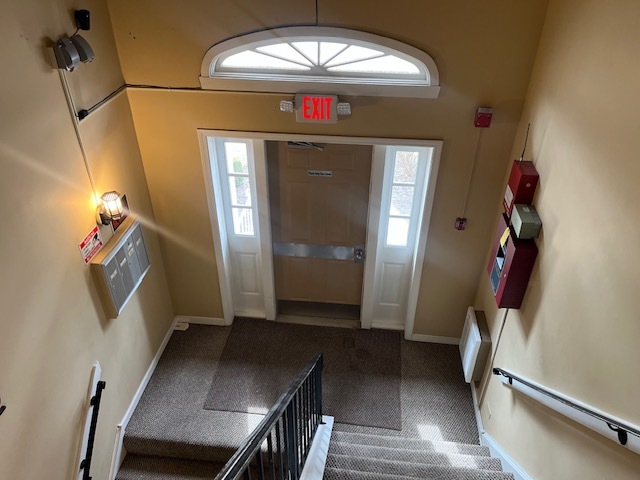 4020 216th Street, Unit 2E Matteson, IL 60443 - Photo 11 of 12 a view of a livingroom with furniture window wooden floor and stairs