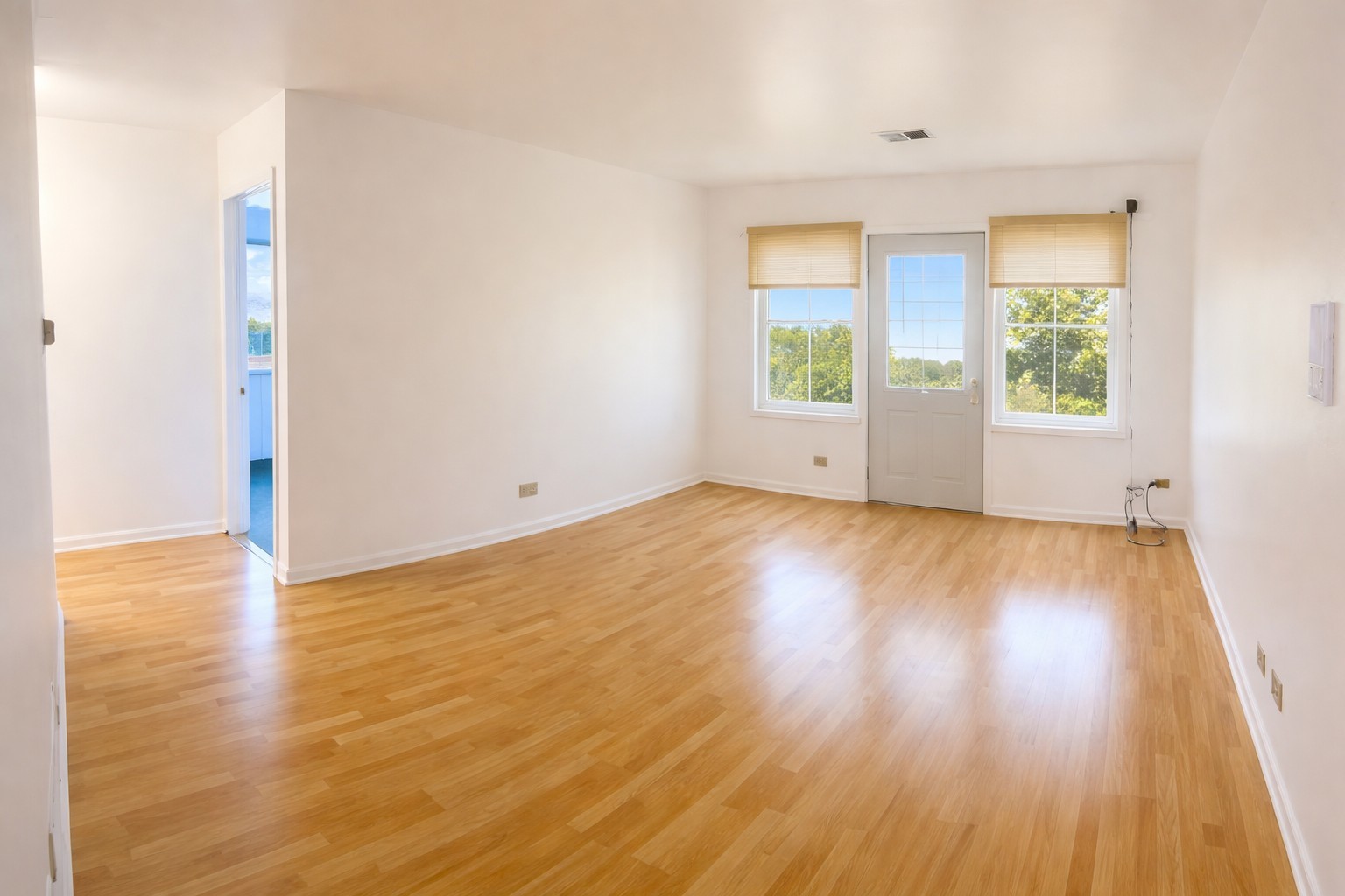4020 216th Street, Unit 2E Matteson, IL 60443 - Photo 4 of 12 a view of an empty room with wooden floor and a window