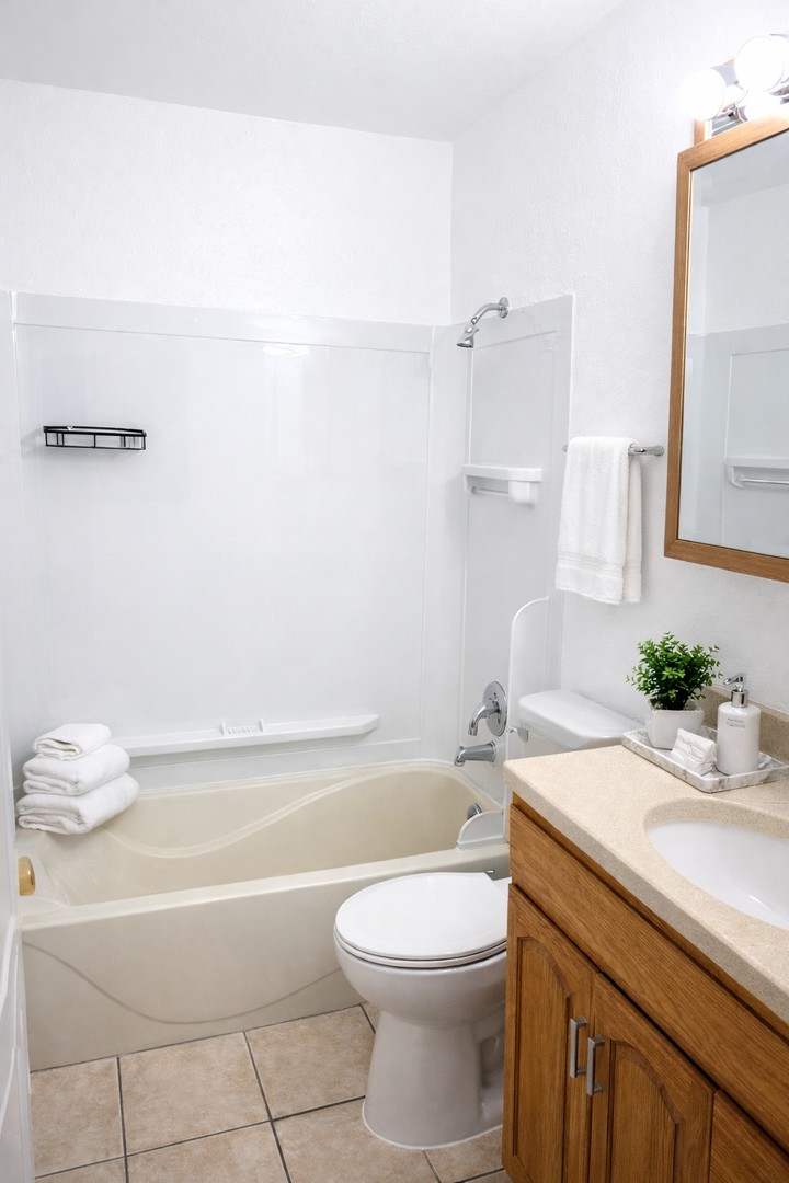4020 216th Street, Unit 2E Matteson, IL 60443 - Photo 5 of 12 a bathroom with a sink a toilet and bathtub