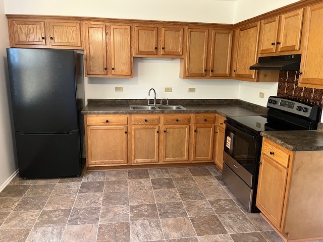 4020 216th Street, Unit 2E Matteson, IL 60443 - Photo 10 of 12 a kitchen with granite countertop a refrigerator stove top oven and sink