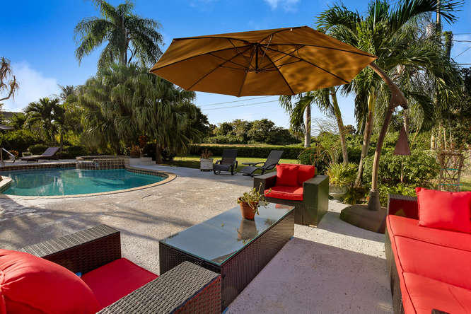 151 South Country Club Boulevard Boca Raton, FL 33487 - Photo 3 of 48 Large back yard with pool and patio