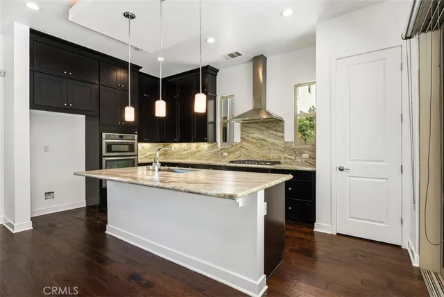 a kitchen with a stove and a sink