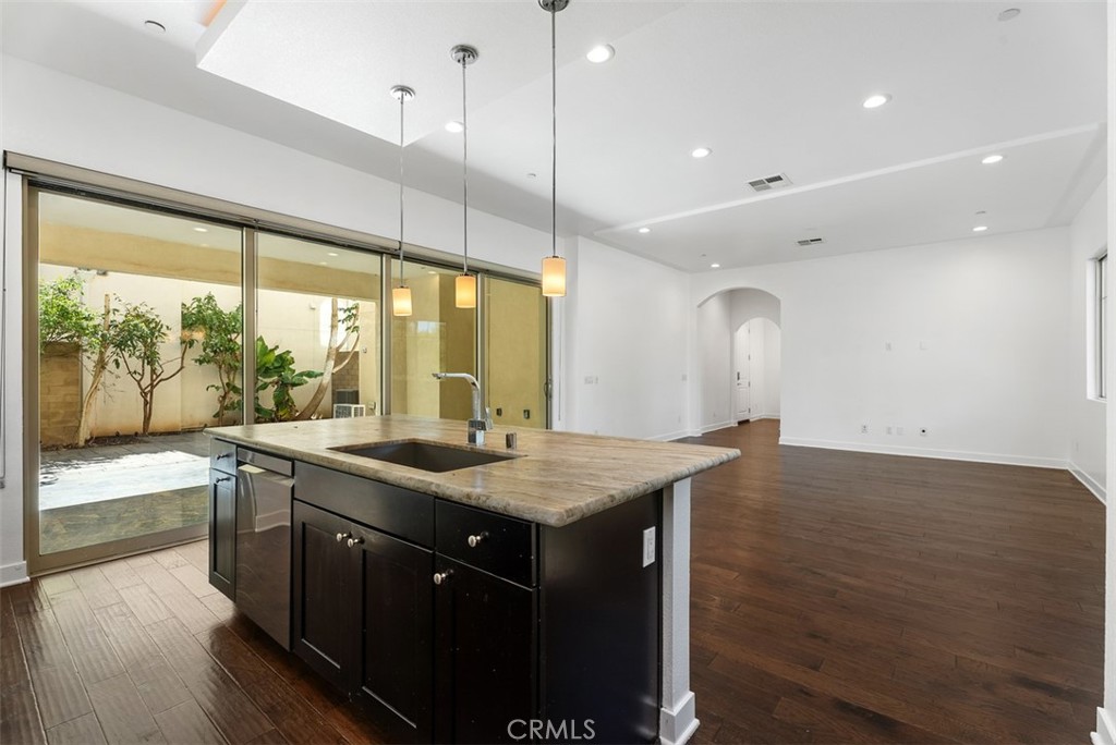 123 Interval Irvine, CA 92618 - Photo 14 of 75 a kitchen with a stove and a sink